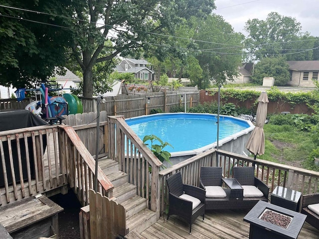 152 Hoyt St, Fond Du Lac, WI 54935 - view of pool with a deck, a fenced backyard, stairs, and a fire pit