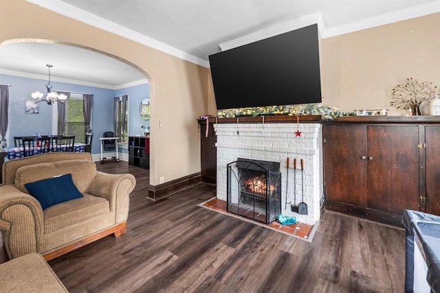152 Hoyt St, Fond Du Lac, WI 54935 - living room featuring arched walkways, wood finished floors, a chandelier, a fireplace, and ornamental molding