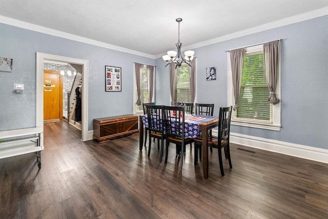 152 Hoyt St, Fond Du Lac, WI 54935 - dining space with a chandelier, dark wood-style floors, and crown molding