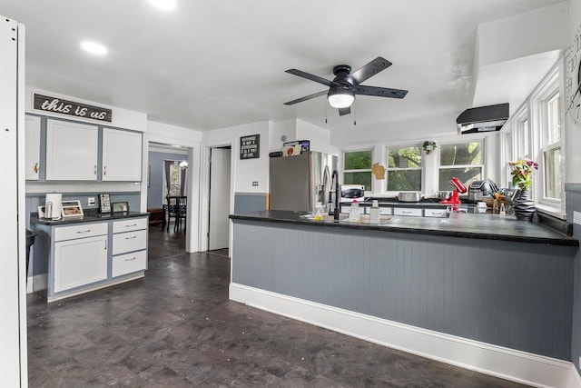 152 Hoyt St, Fond Du Lac, WI 54935 - kitchen featuring stainless steel refrigerator with ice dispenser, dark countertops, ceiling fan, white cabinets, and recessed lighting
