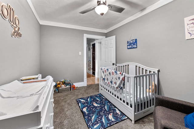 152 Hoyt St, Fond Du Lac, WI 54935 - bedroom featuring carpet floors, crown molding, a crib, and a ceiling fan