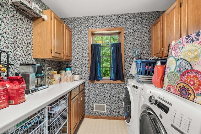 2621 Russet Dr, Plover, WI 54467 - laundry room with wallpapered walls, cabinet space, and independent washer and dryer