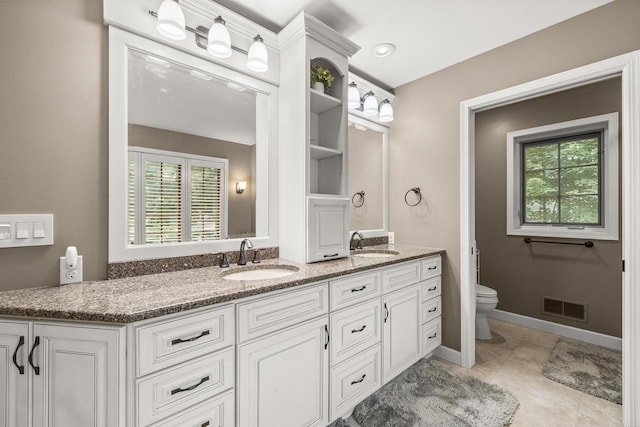 2621 Russet Dr, Plover, WI 54467 - full bathroom with double vanity and healthy amount of natural light