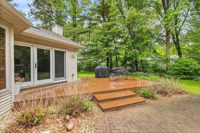 2621 Russet Dr, Plover, WI 54467 - deck with a grill and view of wooded area