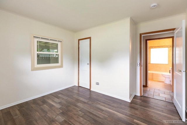 29 S Midvale Blvd, Madison, WI 53705 - unfurnished bedroom with dark wood-style flooring, crown molding, and a closet