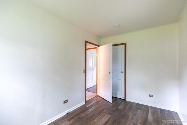 29 S Midvale Blvd, Madison, WI 53705 - spare room with dark wood-style flooring, a smoke detector, and crown molding