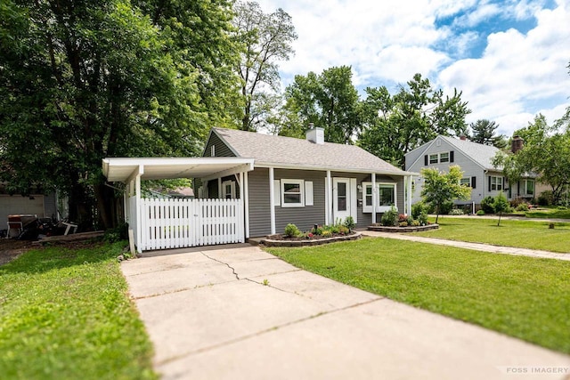 29 S Midvale Blvd, Madison, WI 53705 - view of front of house featuring concrete driveway, a chimney, and an attached carport