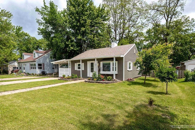 29 S Midvale Blvd, Madison, WI 53705 - view of front of property with concrete driveway, a front yard, an attached carport, and a chimney
