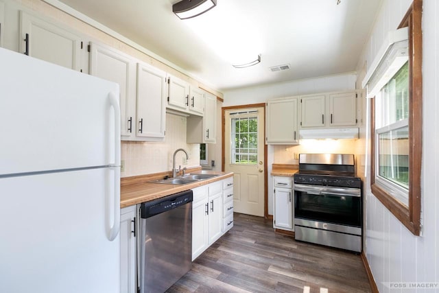 29 S Midvale Blvd, Madison, WI 53705 - kitchen with stainless steel appliances, under cabinet range hood, light countertops, tasteful backsplash, and dark wood-type flooring