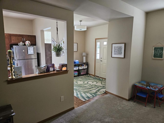 4868-4882 Innovation Dr, Deforest, WI 53532 - kitchen with freestanding refrigerator, plenty of natural light, and carpet floors