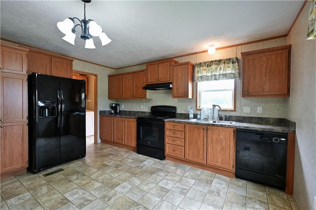 2329 Sand Rd, Shell Lake, WI 54871 - kitchen with black appliances, under cabinet range hood, a chandelier, brown cabinetry, and crown molding