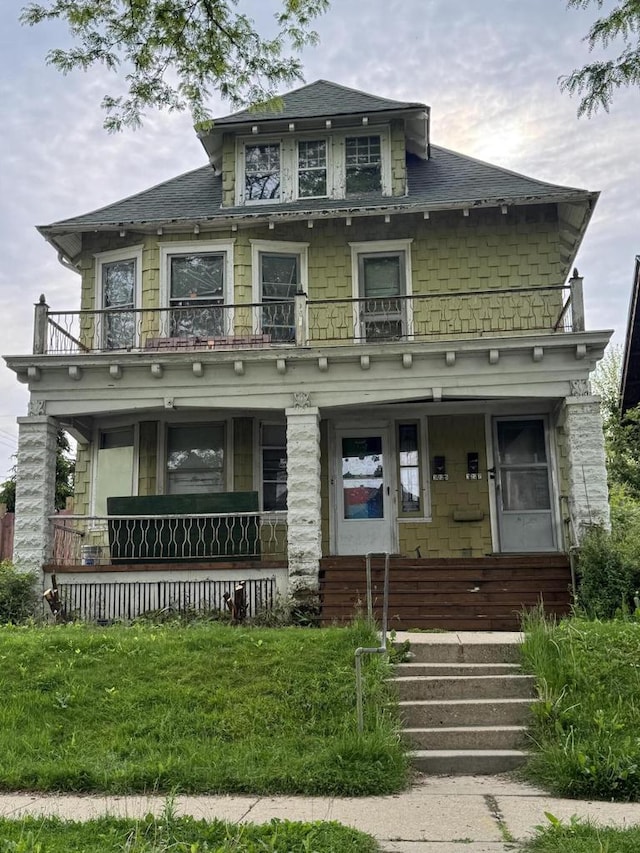 3225 N 24th Pl Unit 3227, Milwaukee, WI 53206 - american foursquare style home with a balcony, covered porch, and a shingled roof