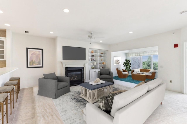 1610 Wheeler Rd Unit 2C, Madison, WI 53704 - living area featuring a ceiling fan, recessed lighting, built in features, and a glass covered fireplace