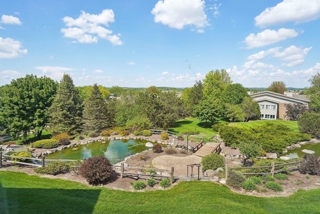 1610 Wheeler Rd Unit 2C, Madison, WI 53704 - view of grassy yard with a garden pond