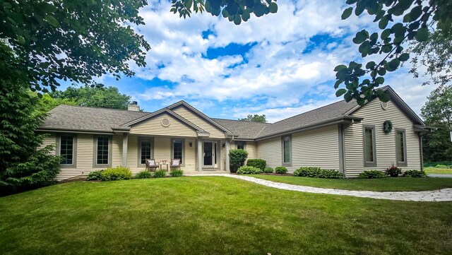 110 Chestnut Way, North Prairie, WI 53153 - ranch-style home featuring a chimney, a front yard, and a shingled roof