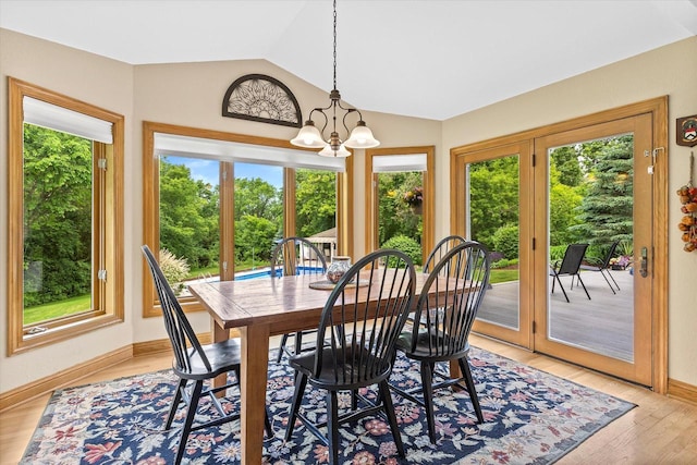 110 Chestnut Way, North Prairie, WI 53153 - dining space with healthy amount of natural light, lofted ceiling, a chandelier, and light wood finished floors