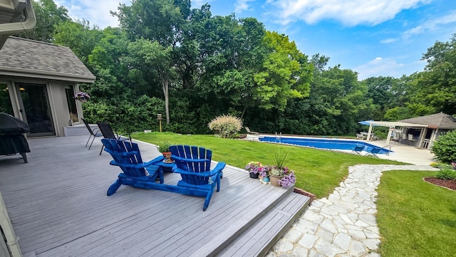110 Chestnut Way, North Prairie, WI 53153 - wooden deck with a lawn, an outdoor pool, an exterior structure, and an outbuilding