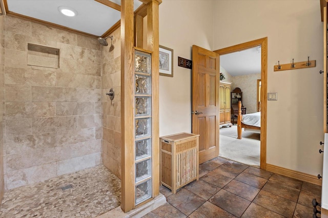 110 Chestnut Way, North Prairie, WI 53153 - bathroom with tiled shower, connected bathroom, and stone finish flooring