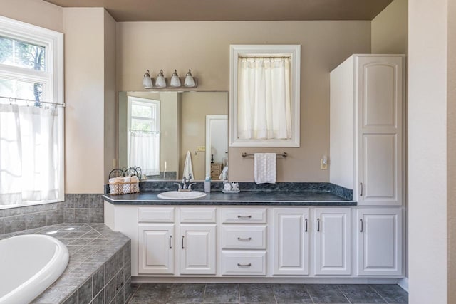 3864 Candlish Harbor Ln, Oshkosh, WI 54902 - bathroom with a bath, double vanity, and healthy amount of natural light