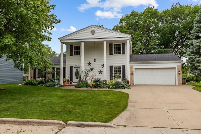 805 N Canterbury Dr, Appleton, WI 54915 - neoclassical home featuring brick siding, an attached garage, a front yard, and concrete driveway