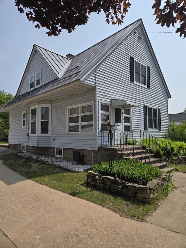 624 Depot St, Manawa, WI 54949 - view of front facade with a standing seam roof and a metal roof