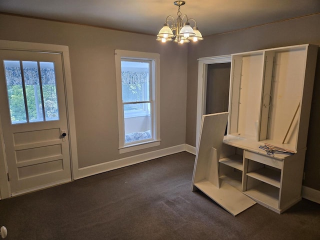 624 Depot St, Manawa, WI 54949 - unfurnished bedroom featuring multiple windows, a chandelier, and dark carpet