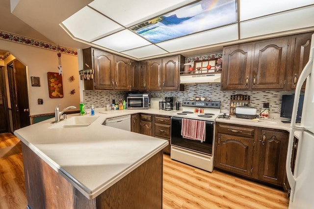 8420 Southview Dr, Crandon, WI 54520 - kitchen with range with electric stovetop, under cabinet range hood, a peninsula, white dishwasher, and light countertops