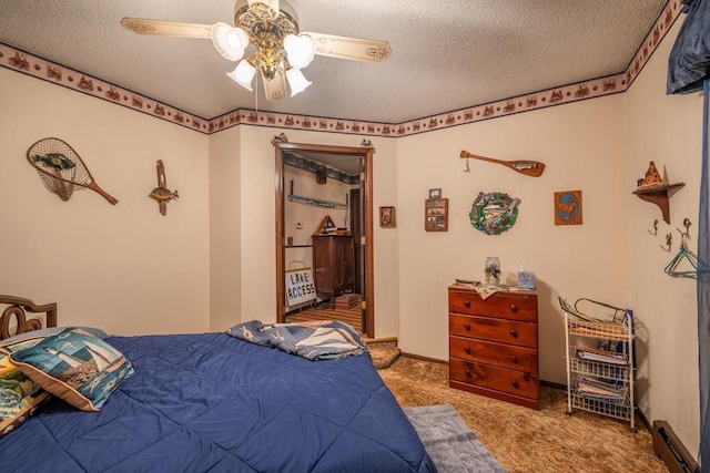 8420 Southview Dr, Crandon, WI 54520 - bedroom featuring a textured ceiling, carpet floors, a baseboard radiator, and ceiling fan