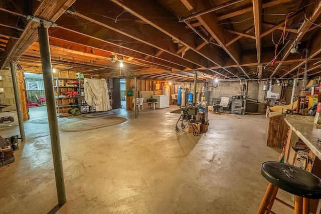 8420 Southview Dr, Crandon, WI 54520 - unfinished below grade area featuring washer and clothes dryer and water heater