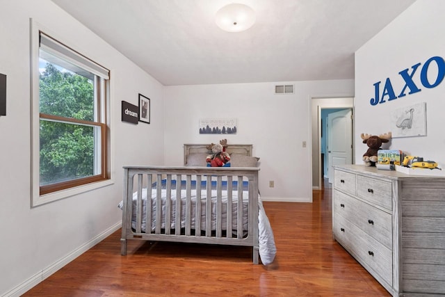 1434 Alcan Dr, Menasha, WI 54952 - bedroom featuring wood finished floors and baseboards