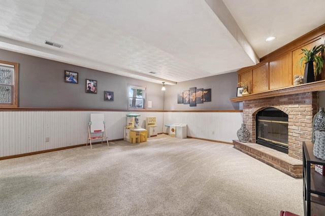 1434 Alcan Dr, Menasha, WI 54952 - unfurnished room featuring carpet floors, wainscoting, a fireplace, and recessed lighting