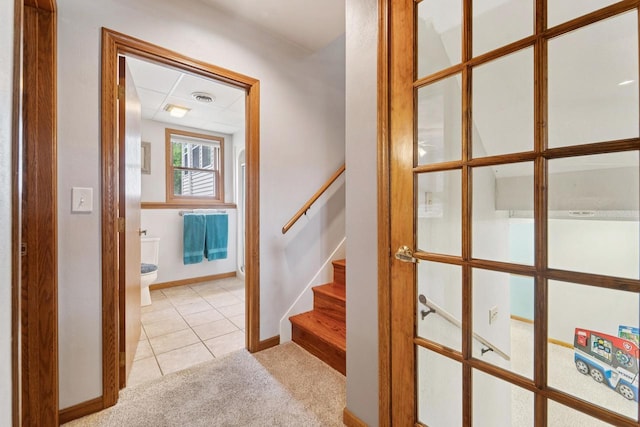 1434 Alcan Dr, Menasha, WI 54952 - stairs with carpet and tile patterned flooring