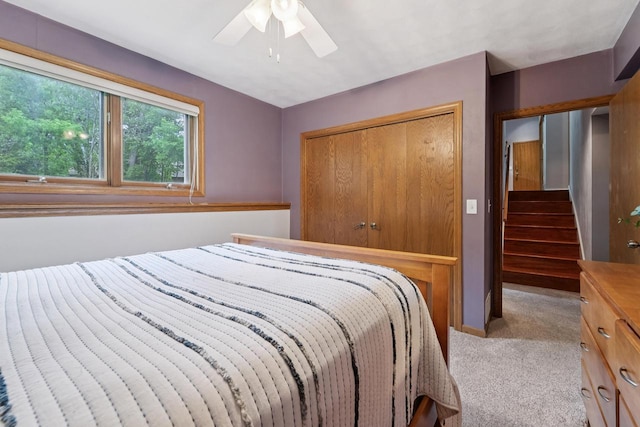 1434 Alcan Dr, Menasha, WI 54952 - bedroom with light carpet, a closet, and ceiling fan