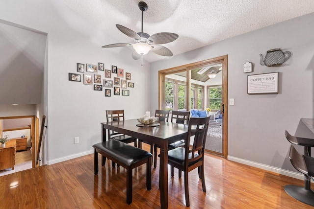 1434 Alcan Dr, Menasha, WI 54952 - dining area with light wood-type flooring, a textured ceiling, and a ceiling fan