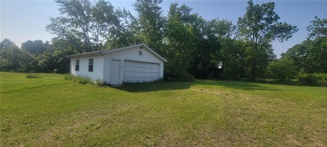 N3598 Nichols Rd, Black River Falls, WI 54615 - view of green lawn featuring an outbuilding and a garage