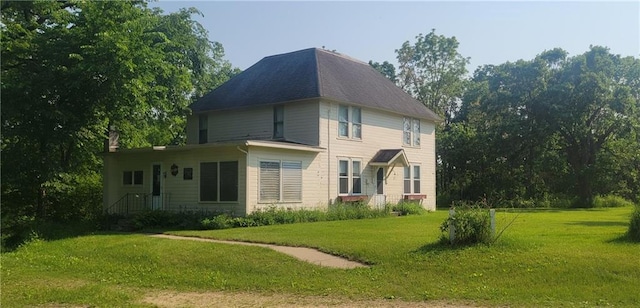 N3598 Nichols Rd, Black River Falls, WI 54615 - rear view of house featuring a lawn