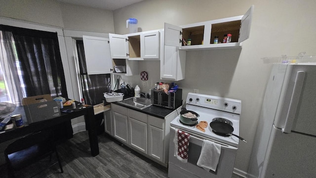 434 N 32nd St, Milwaukee, WI 53208 - kitchen featuring white appliances, open shelves, dark wood finished floors, and dark countertops