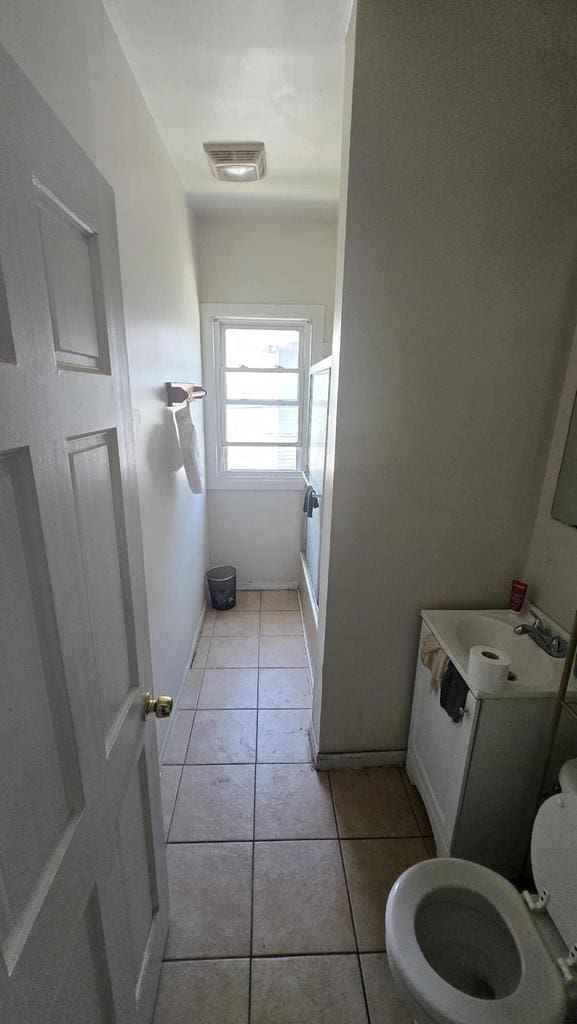434 N 32nd St, Milwaukee, WI 53208 - bathroom featuring tile patterned floors and vanity