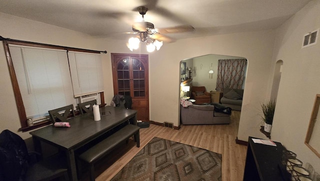3240 N Richards St Unit 3242, Milwaukee, WI 53212 - dining space with a ceiling fan, light wood finished floors, and arched walkways