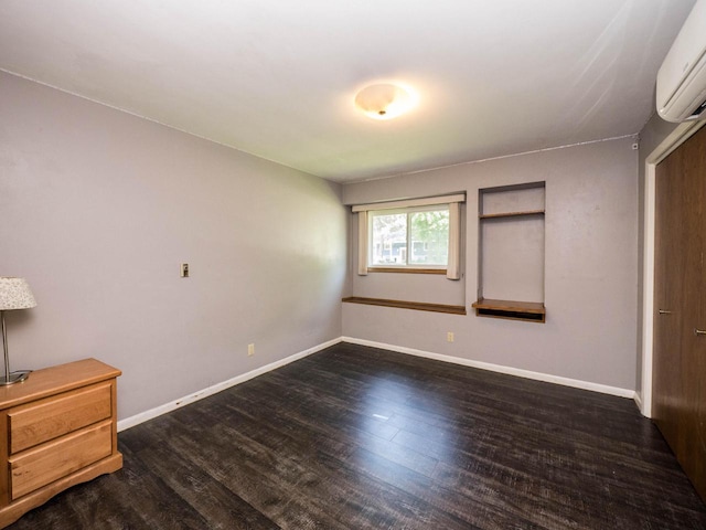 614 Decker Dr, West Bend, WI 53090 - unfurnished bedroom featuring a wall unit AC and wood finished floors