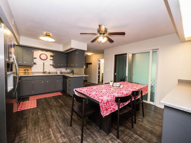 614 Decker Dr, West Bend, WI 53090 - dining room featuring ceiling fan and dark wood-style floors