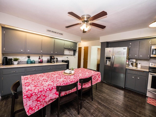 614 Decker Dr, West Bend, WI 53090 - kitchen featuring appliances with stainless steel finishes, ceiling fan, and light countertops