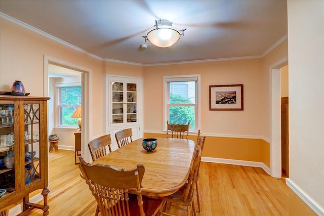818 Ottawa Trl, Madison, WI 53711 - dining area with light wood-style flooring and ornamental molding