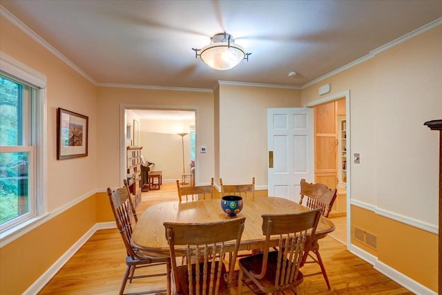 818 Ottawa Trl, Madison, WI 53711 - dining area featuring light wood-type flooring and ornamental molding