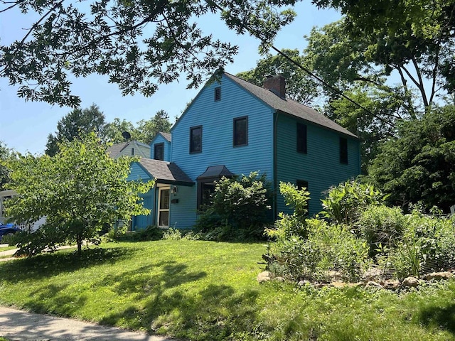 818 Ottawa Trl, Madison, WI 53711 - view of side of property featuring a chimney, a yard, and a shingled roof