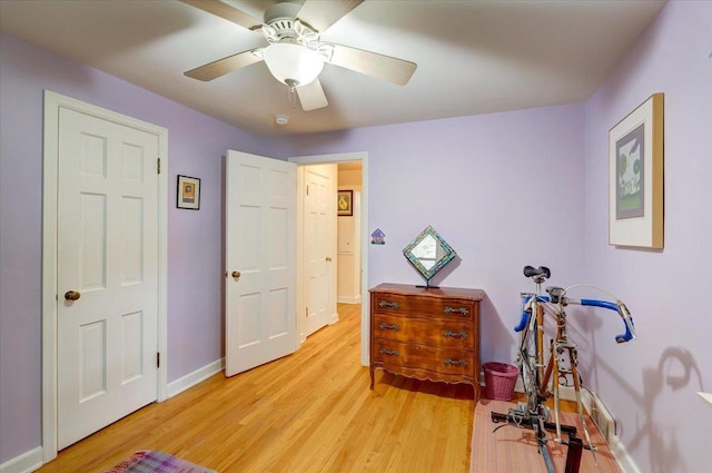 818 Ottawa Trl, Madison, WI 53711 - workout room featuring light wood-style flooring and ceiling fan