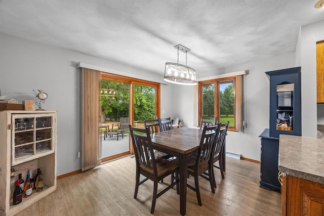 1341 Fieldstone Ct, Neenah, WI 54956 - dining area with wood finished floors and a chandelier