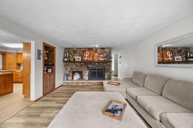 1341 Fieldstone Ct, Neenah, WI 54956 - living area featuring light wood-type flooring and a fireplace