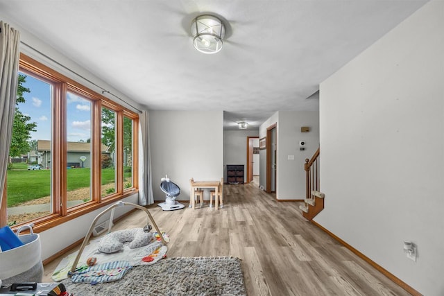 1341 Fieldstone Ct, Neenah, WI 54956 - living area with light wood-type flooring and stairs