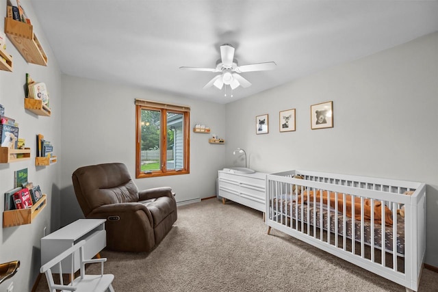 1341 Fieldstone Ct, Neenah, WI 54956 - carpeted bedroom with a crib, baseboard heating, and ceiling fan